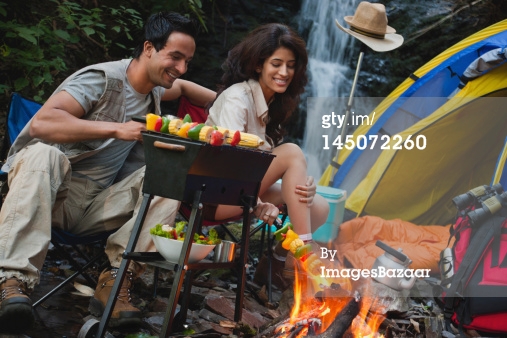 couple at camp fire